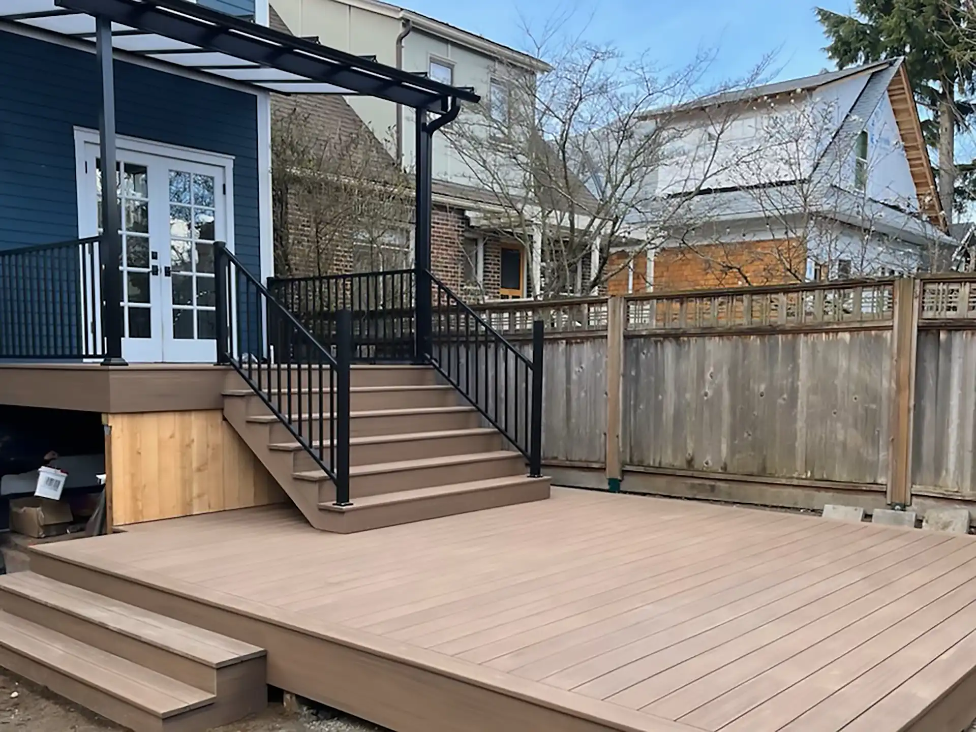 photo of a multi-level deck with a deck cover and deck railing - custom decks builder in seattle