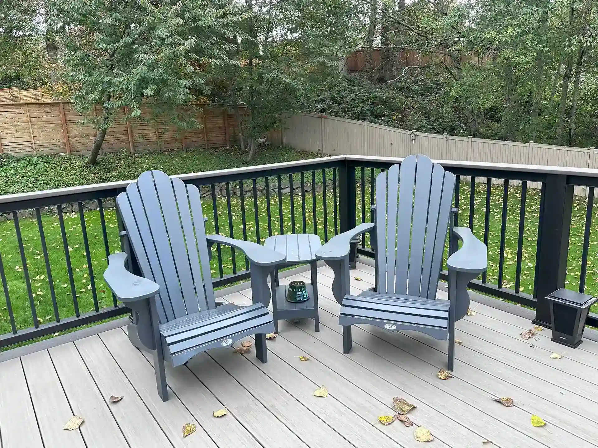 Composite deck with deck railing and Adirondack chairs - Trex Decks - Composite Deck Builders Near Me WA