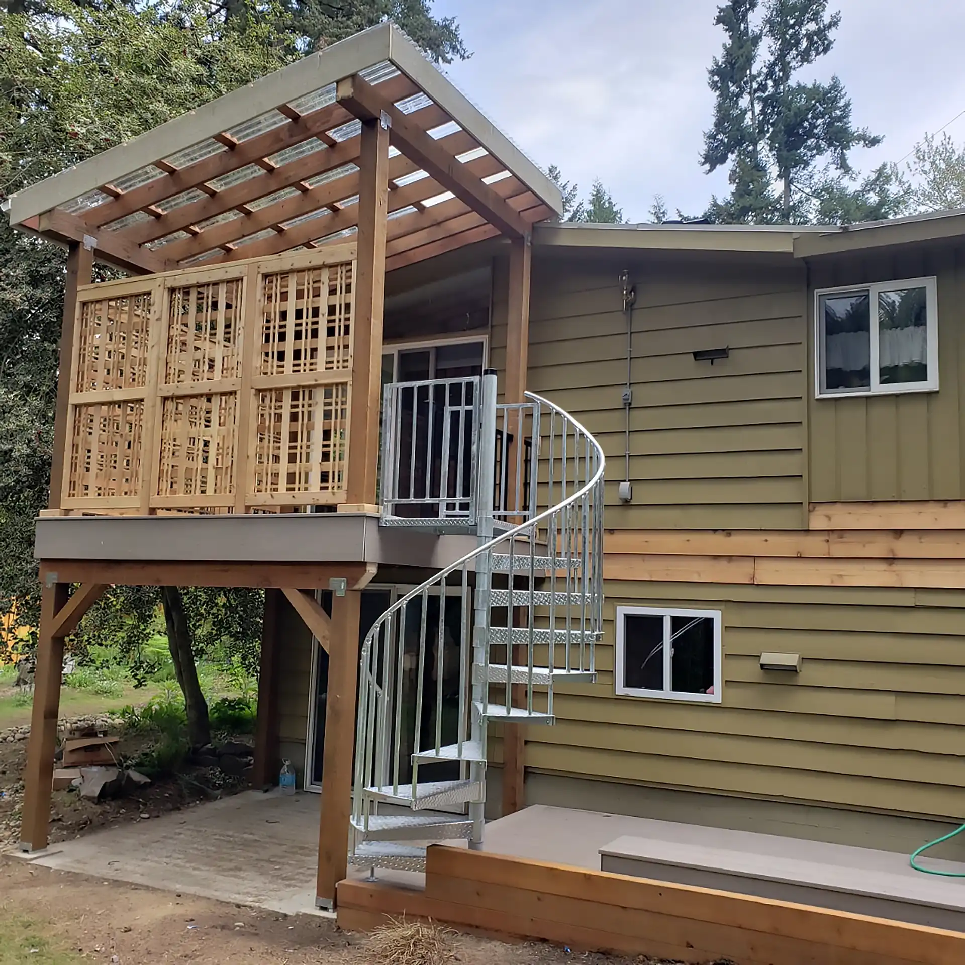 photo of an elevated deck with a pergola style shade structure to provide cover, on of this year's deck design trends